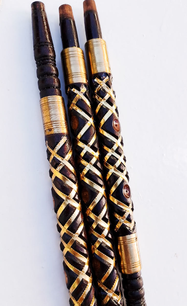 Black sebsi stem inlaid with a cream bone lattice and gold thread
