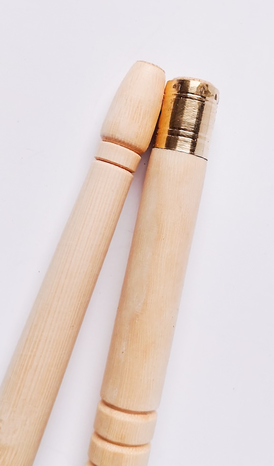 Two pale ivory sebsi pipes finished with a single brass band