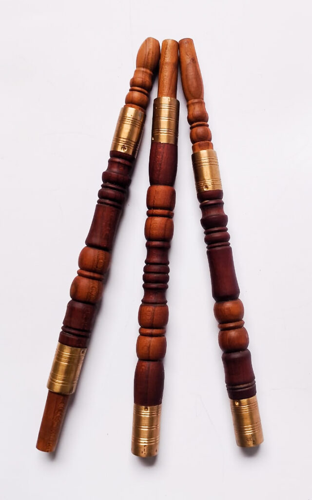 Sebsi stems turned into stacked beads in red and tan wood