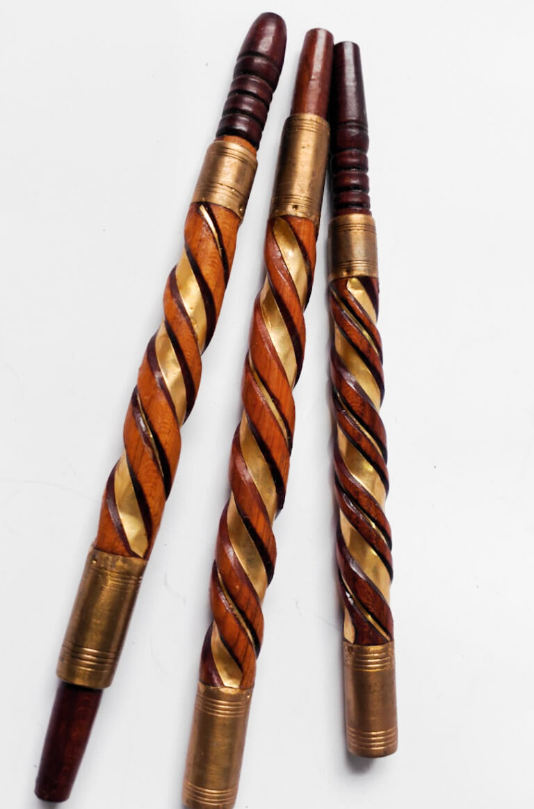Ginger-toned spiral-carved sebsi pipes with brass bands