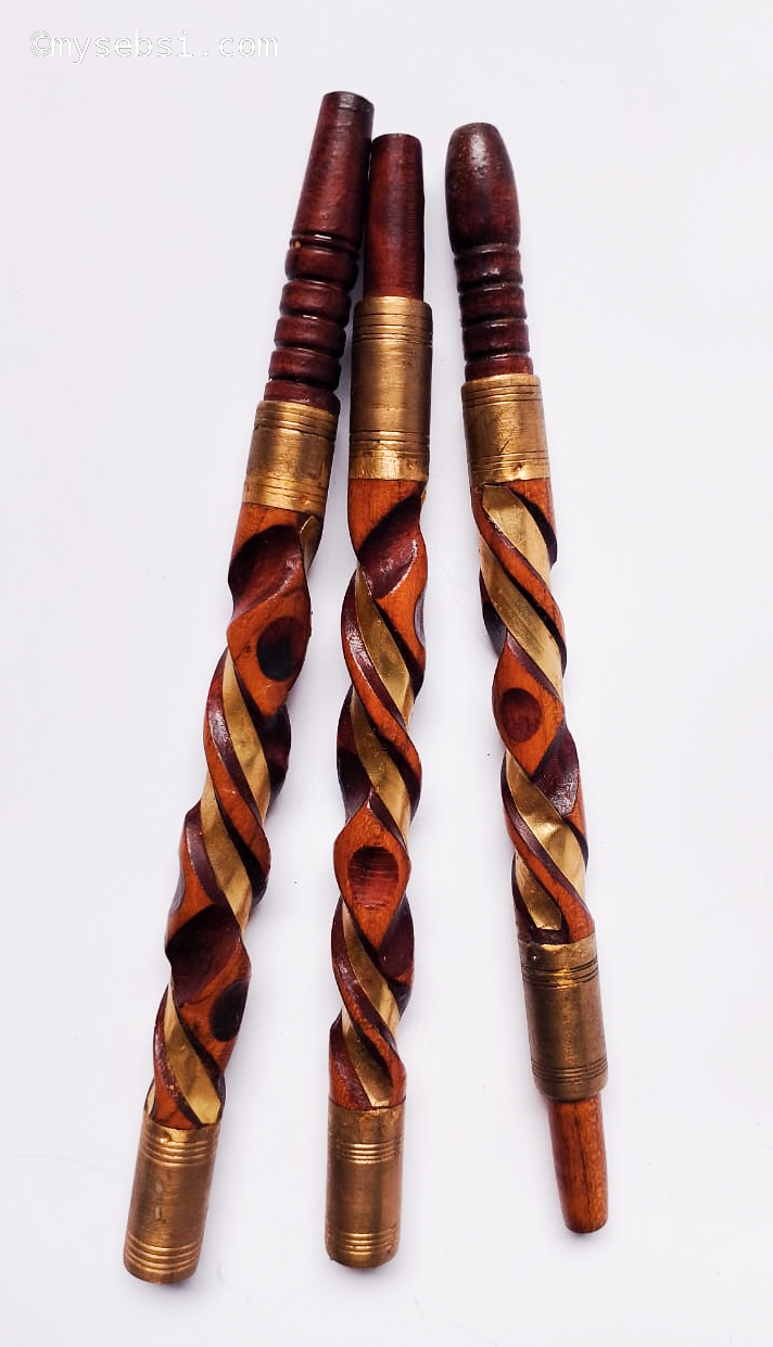 Three copper-toned spiral-carved sebsi pipes with brass tips
