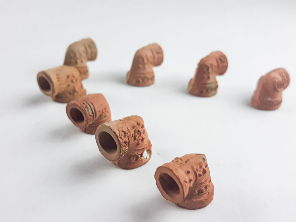 Hand-formed terracotta sebsi bowls, carved and plain